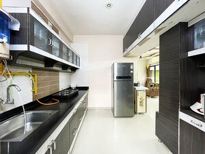 Kitchen in 2 BHK Apartment at Sola – for Sale