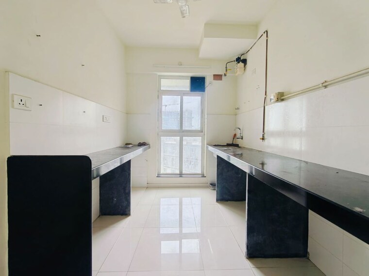 Kitchen, godrej-emerald 2 Bedroom 708 Sq.Ft. Apartment In Ghodbunder Road Thane 10592330