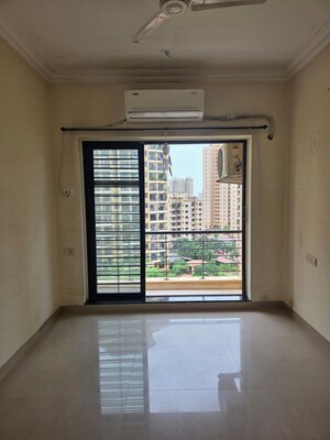 Living Room in 1 BHK Apartment at K Raheja Heights, Malad East – for Rent