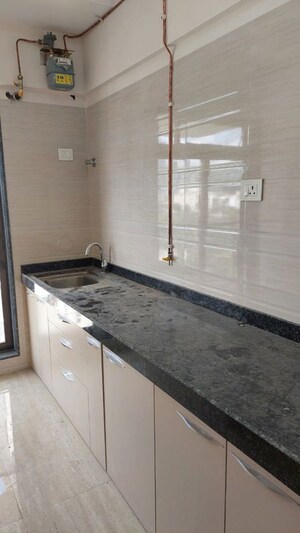 Kitchen in 1.5 BHK Apartment at Roha Satsang Bharti, Malad East – for Sale