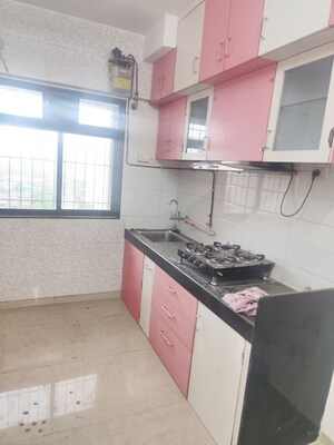 Kitchen in 2 BHK Apartment at Raunak Unnathi Greens, Kasarvadavali – for Rent