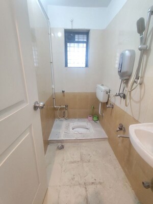 Bathroom in 2 BHK Apartment at Raunak Unnathi Greens, Kasarvadavali – for Rent