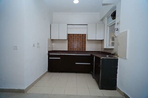 Kitchen in 2 BHK Apartment at Amrapali Zodiac, Sector 120 – for Sale