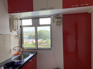 Kitchen in 3 BHK Apartment at Simran Society, Naupada – for Rent