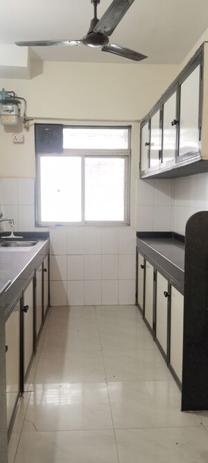 Kitchen in 2 BHK Apartment at Nirmal Lifestyle Residency CHS Ltd, Mulund West – for Rent