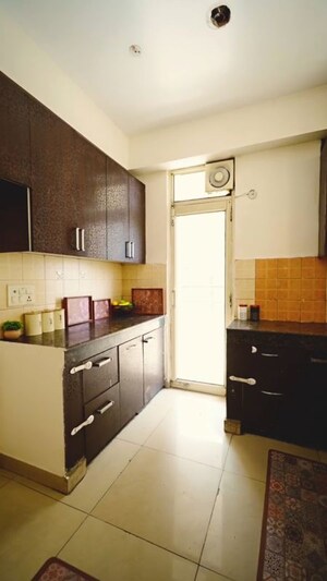 Kitchen in 2 BHK Apartment at Ajnara Gen X, Dundahera – for Sale