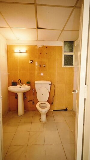 Bathroom in 2 BHK Apartment at Bulland Heights, Sain Vihar – for Sale
