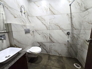 Bathroom in 3 BHK Apartment at Dhakoli – for Sale