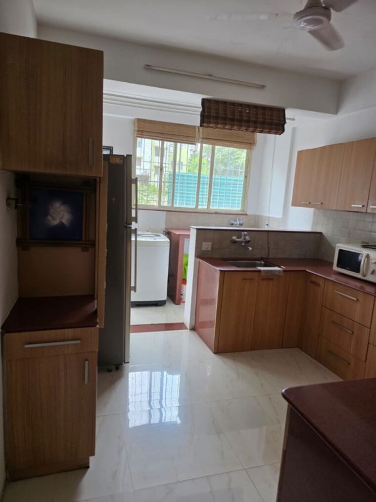 Kitchen, pearl-apartments-baner 3 Bedroom 1000 Sq.Ft. Independent House In Baner Pune 10512062