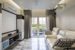 Living Room in 4 BHK Apartment at Kolte Patil 24K Glitterati, Pimple Nilakh – for Sale