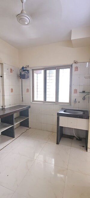 Kitchen in 2 BHK Apartment at Asmita Jyoti CHS, Malad West – for Rent
