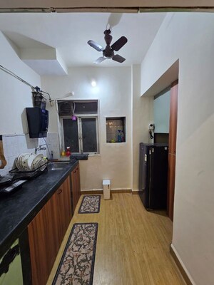 Kitchen in 1 BHK Apartment at Unnati Woods CHS, Kasarvadavali – for Rent