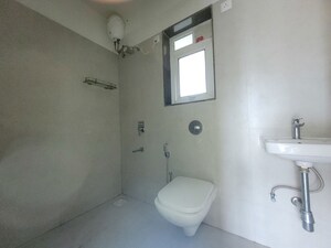 Bathroom in 2 BHK Apartment at Puranik City Reserva, Ghodbunder Road – for Rent
