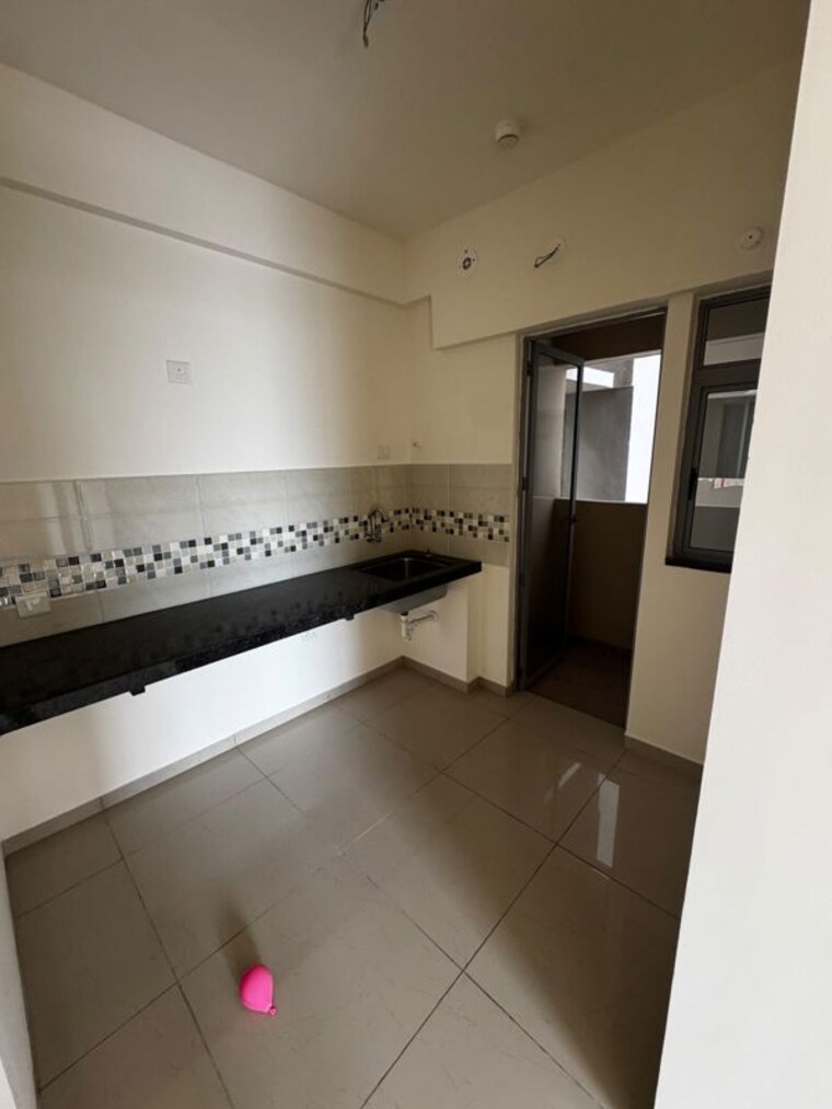 Kitchen, mahindra-happinest-tathawade-phase-1 1 Bedroom 600 Sq.Ft. Apartment In Tathawade Pune 10595216
