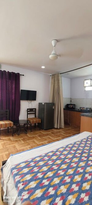 Living Room in Studio Apartment at Defence Colony – for Rent