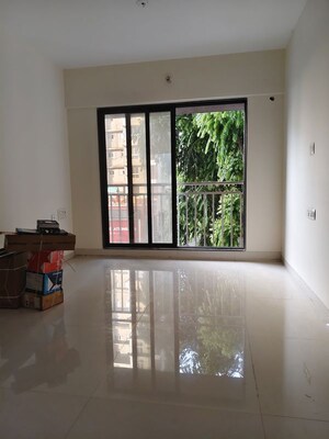 Room in 2.5 BHK Apartment at Madhu Matrusmruti CHS, Goregaon West – for Sale