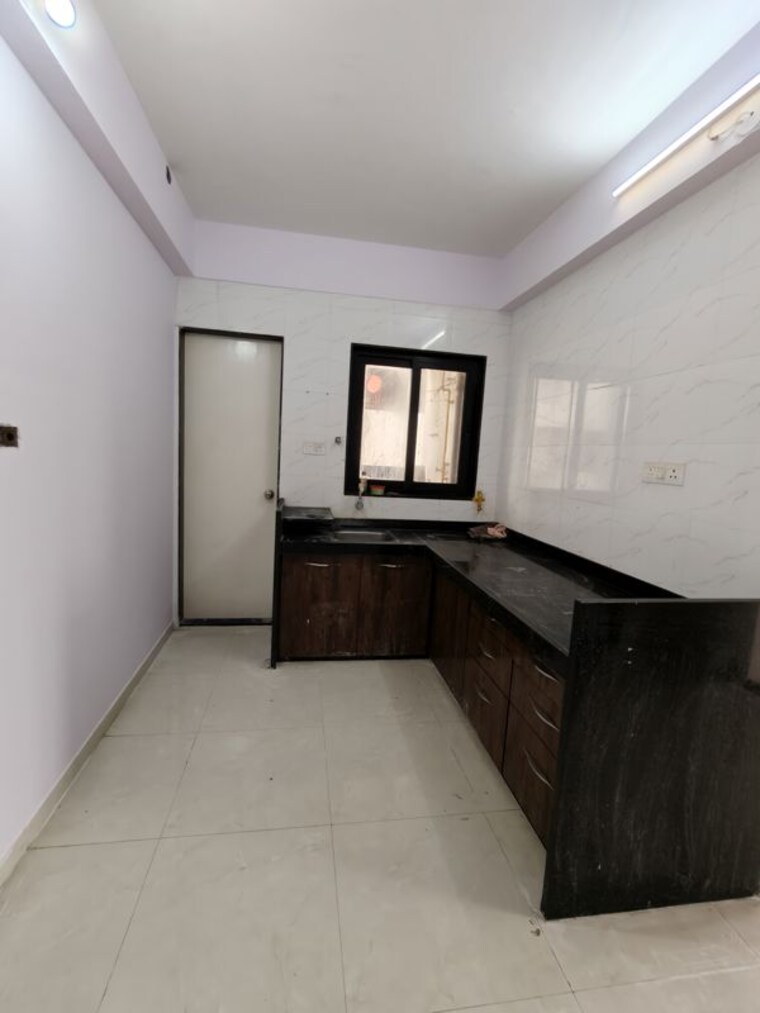 Kitchen, dahin nagar 2 Bedroom 900 Sq.Ft. Apartment In Dahin Nagar Surat 10595858