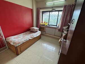 Bedroom in 2 BHK Apartment at Satellite Garden, Goregaon East – for Rent