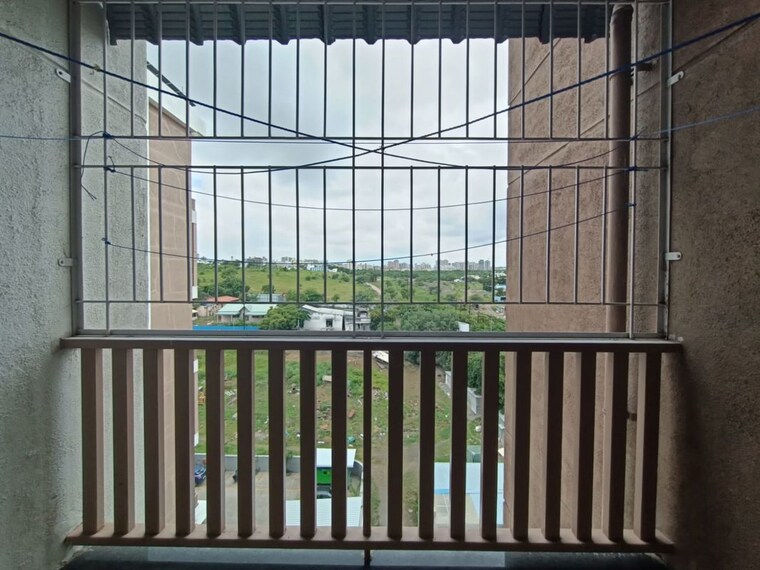 Balcony, bk-jhala-simpli-city-phase-ii 2.5 Bedroom 1100 Sq.Ft. Apartment In Handewadi Pune 10596366