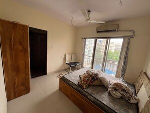 Bedroom in 3 BHK Apartment at Naman Habitat, Andheri West – for Rent