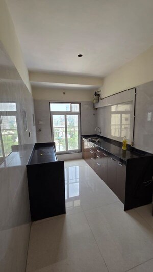 Kitchen in 2 BHK Apartment at Om Heights Malad, Malad East – for Rent