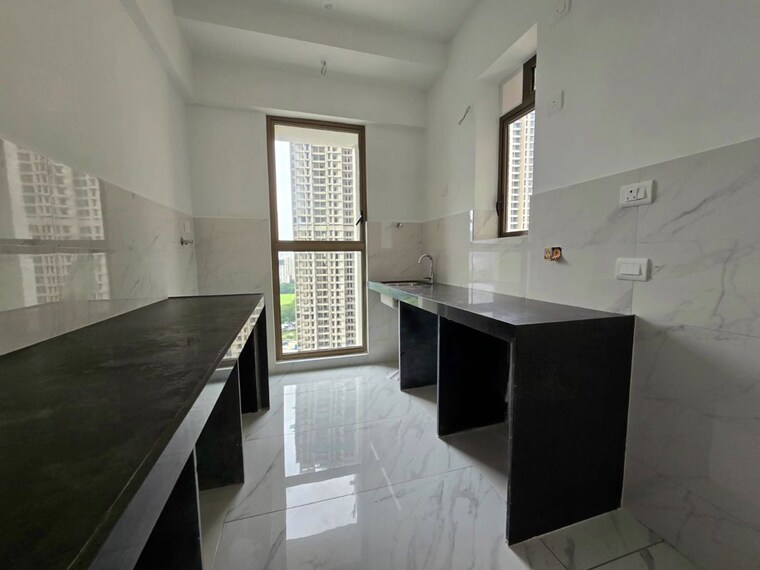 Kitchen, raymond-ten-x-habitat 2 Bedroom 700 Sq.Ft. Apartment In Pokhran Road No Two Thane 10597117