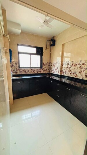 Kitchen in 1 BHK Apartment at Neel Darpan CHS, New Panvel – for Rent