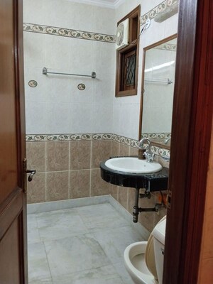 Bathroom in 3 BHK Builder Floor at Kalkaji – for Rent