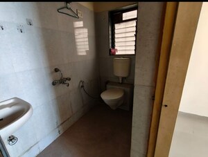 Bathroom in 2 BHK Apartment at Puranik City, Kasarvadavali – for Rent