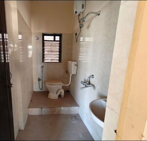 Bathroom in 2 BHK Apartment at Puranik City, Kasarvadavali – for Rent