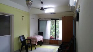Living Room in 1 BHK Apartment at Roof Top Chs Ltd, Andheri East – for Rent