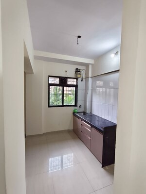 Kitchen in 1 BHK Apartment at Unnathi Woods Phase 1 And 2, Ghodbunder Road – for Rent