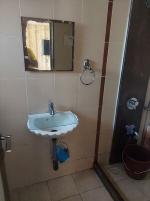 Bathroom in 3 BHK Apartment at Agarwal Trinity Towers, Malad West – for Rent