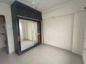 Bedroom in 2 BHK Apartment at Royal Pleasant Park CHS, Malad West – for Rent