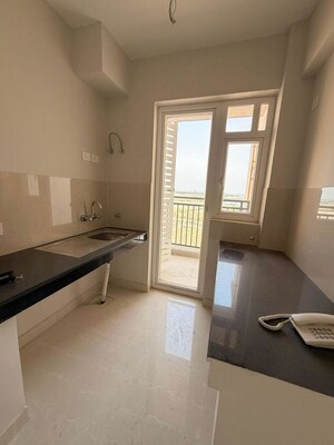 Living Room in 2 BHK Apartment at Eldeco Live By The Greens, Sector 150 – for Rent