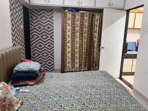 Bedroom in 2 BHK Apartment at Mahasiddivinayak CHS, Borivali West – for Sale