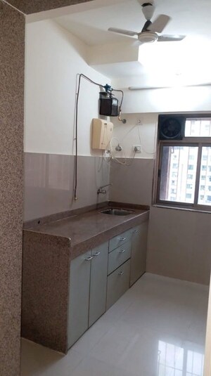 Kitchen in 1 BHK Apartment at Ram Pushpanjali Residency, Owale – for Rent