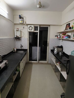 Kitchen in 2 BHK Apartment at Ram Pushpanjali Residency, Owale – for Rent