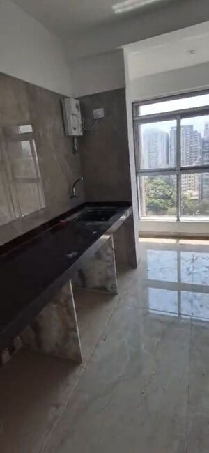 Kitchen in 3 BHK Apartment at Infinity Paradise CHS, Goregaon West – for Rent