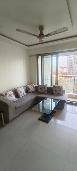 Living Room in 2 BHK Apartment at Rustomjee Elanza, Malad West – for Rent