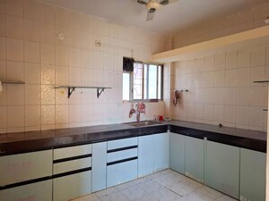 Kitchen in 2 BHK Apartment at Pranayraj Plaza, Dhanori – for Rent