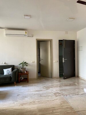 Living Room in 2 BHK Apartment at Hiranandani Woodpark Apartment, Ghodbunder Road – for Sale