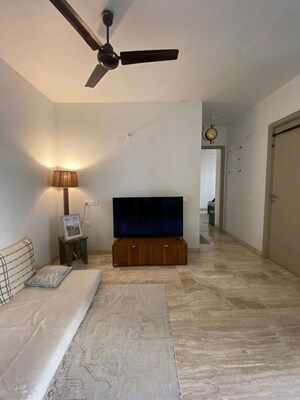 Living Room in 2 BHK Apartment at Hiranandani Woodpark Apartment, Ghodbunder Road – for Sale