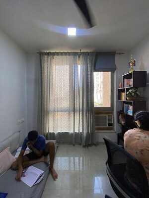 Living Room in 2 BHK Apartment at Hiranandani Woodpark Apartment, Ghodbunder Road – for Sale