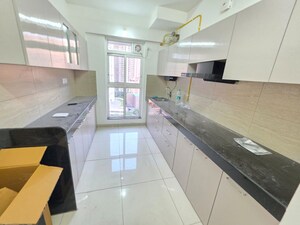 Kitchen in 3 BHK Apartment at Godrej Emerald, Ghodbunder Road – for Rent