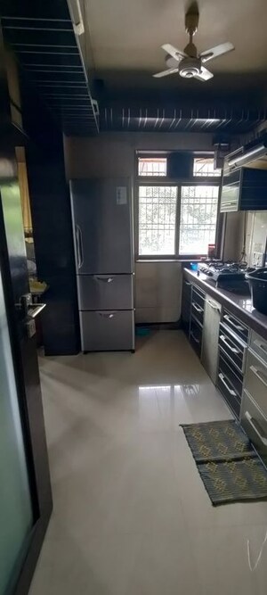 Kitchen in 2 BHK Apartment at Swastik Residency 1, Ghodbunder Road – for Sale