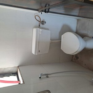 Bathroom in 1 BHK Apartment at Unnati Woods CHS, Kasarvadavali – for Rent