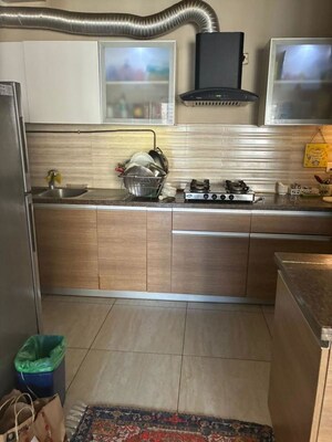 Kitchen in 3 BHK Apartment at ABA Cleo County, Sector 121 – for Rent