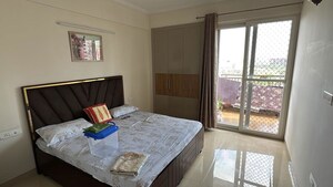 Bedroom in 3 BHK Apartment at Affinity Greens, International Airport Road – for Rent