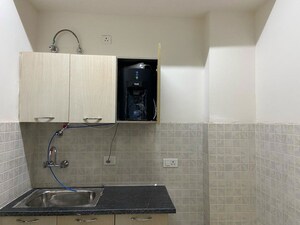 Kitchen in 3 BHK Apartment at Sunworld Vanalika, Sector 107 – for Rent